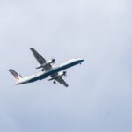 a large airplane flies through the air