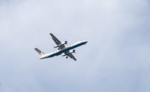 a large airplane flies through the air