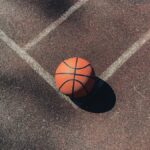 brown basketball on gray concrete floor